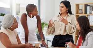 A women in leadership speaking to her team harnessing trust