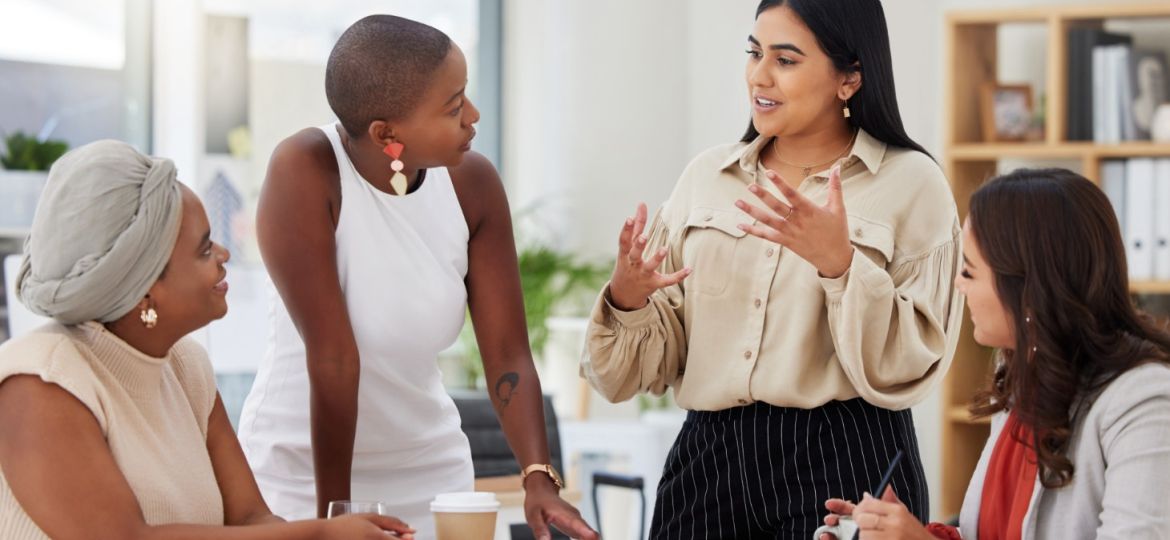 A women in leadership speaking to her team harnessing trust